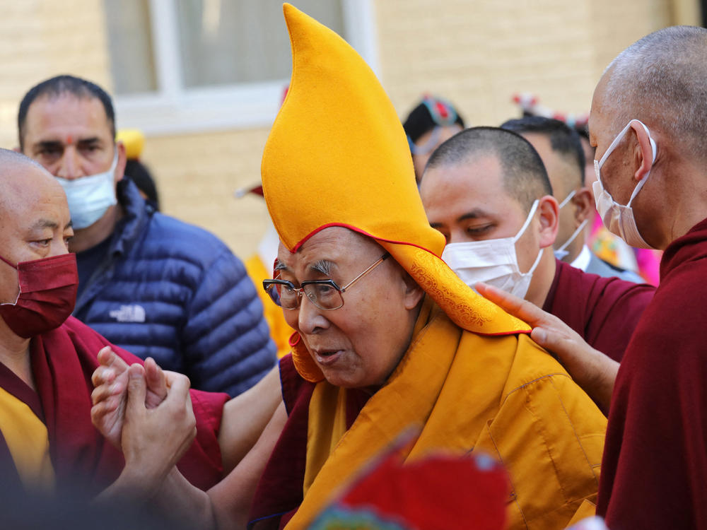 The Dalai Lama, pictured here at a prayer ceremony in McLeod Ganj last week, has come under fire for visibly kissing a young boy on the lips in a video that's been viewed millions of times.