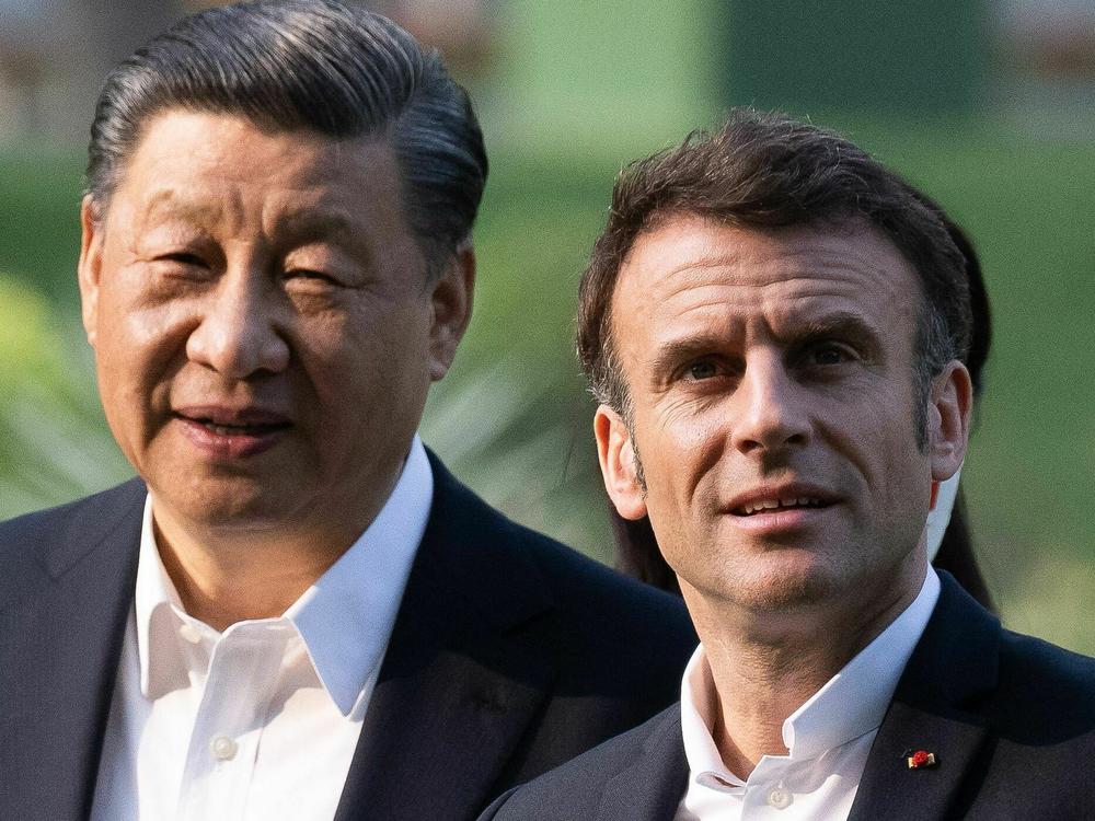 Chinese President Xi Jinping and French President Emmanuel Macron visit the garden of the residence of the Governor of Guangdong on April 7.