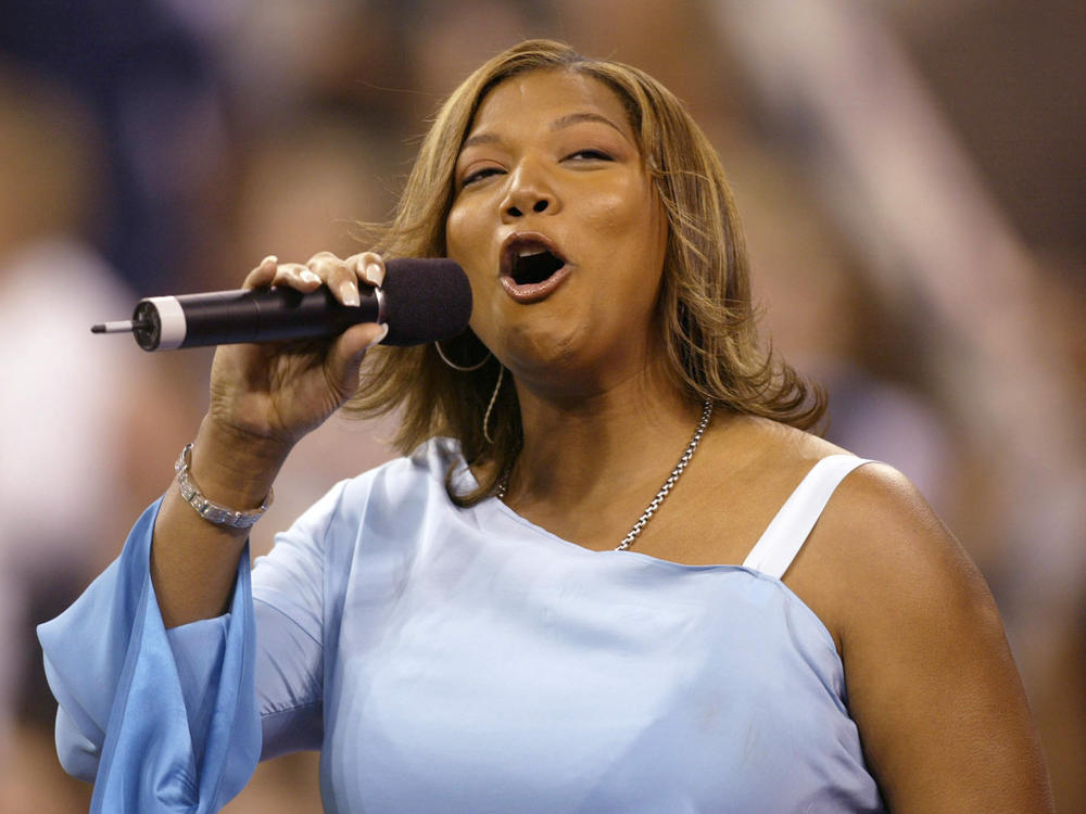 Queen Latifah sings the National Anthem at the opening ceremony of the 2002 US Open at the USTA National Tennis Center in Flushing Meadows Corona Park in Flushing, New York.