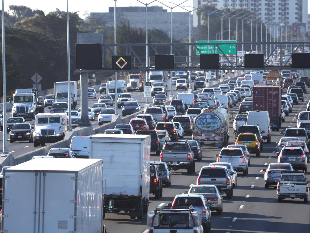 Traffic moves along Interstate 80 in Berkeley, Calif., on Feb. 16, 2022. The Biden administration proposed new tough emission rules so tough it would force auto makers to boost sales of electric cars to meet the requirements.