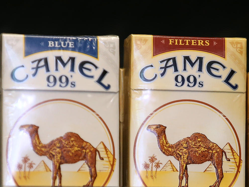 Camel cigarettes, manufactured by Reynolds American, are displayed at a tobacco shop in San Francisco in July 2014. Reynolds was one of the tobacco companies to voluntarily adopt child labor policies that exceed the requirements of U.S. law.