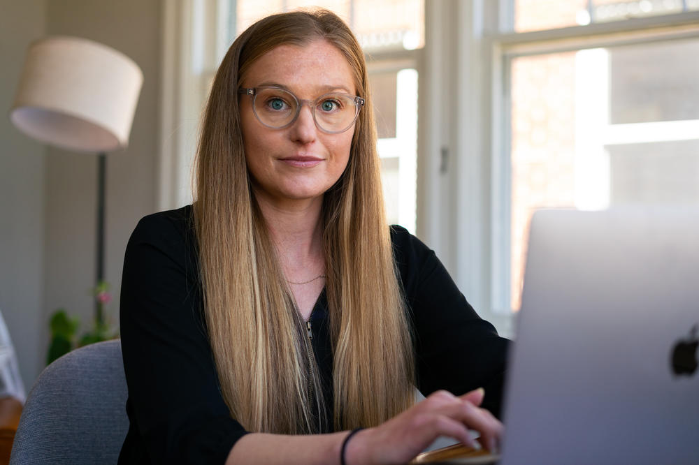 Selena Larson, a cyber threat intelligence researcher for ProofPoint, at her home office.