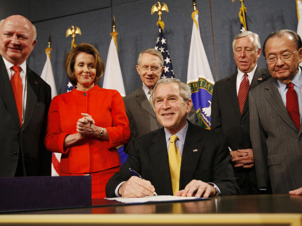 President George W. Bush signs the Energy Independence and Security Act of 2007, Dec. 19, 2007, at the Energy Department in Washington. DC.