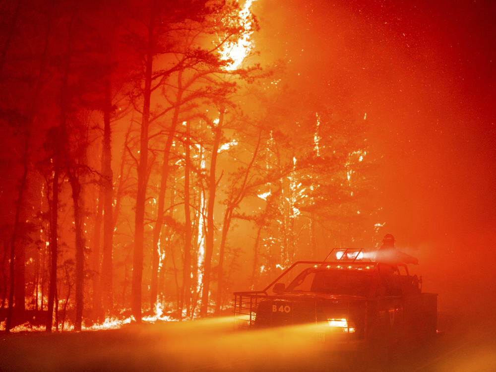 In this photo provided by the New Jersey Department of Environmental Protection, a 2,500-acre forest fire burns in Ocean County, N.J., on Wednesday.