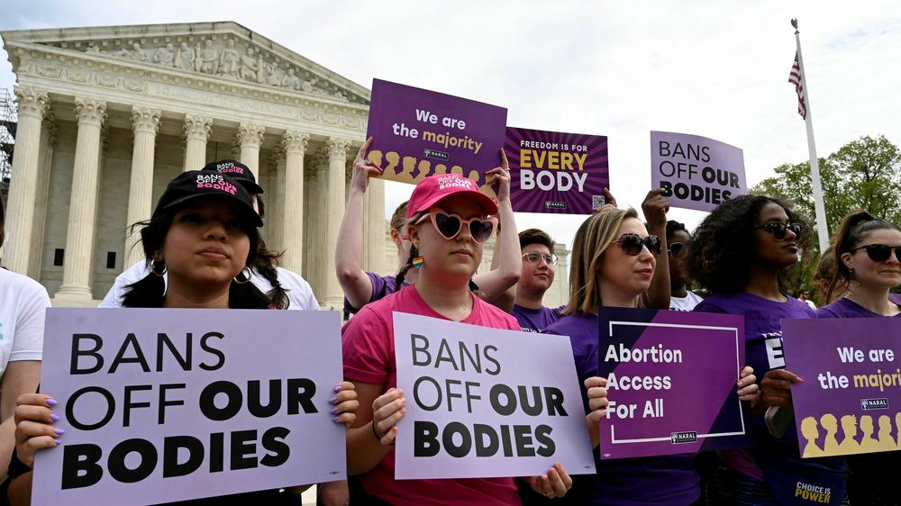Abortion rights advocates rally outside the Supreme Court on Friday, speaking out against abortion pill restrictions.