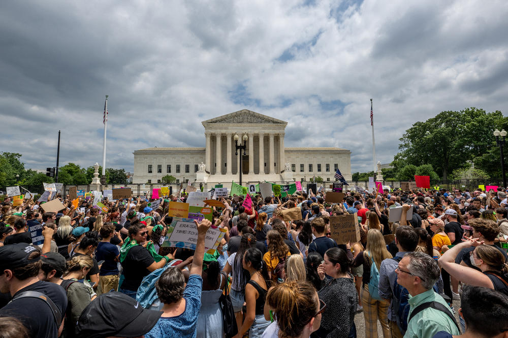 People protest in response to the <em>Dobbs vs. Jackson Women's Health Organization</em> ruling in front of the U.S. Supreme Court on June 24, 2022 in Washington, D.C.
