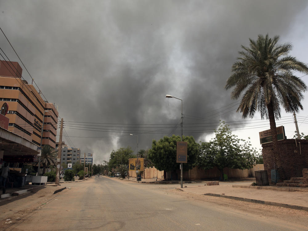 Smoke is seen rising from a neighborhood in Khartoum on Saturday.