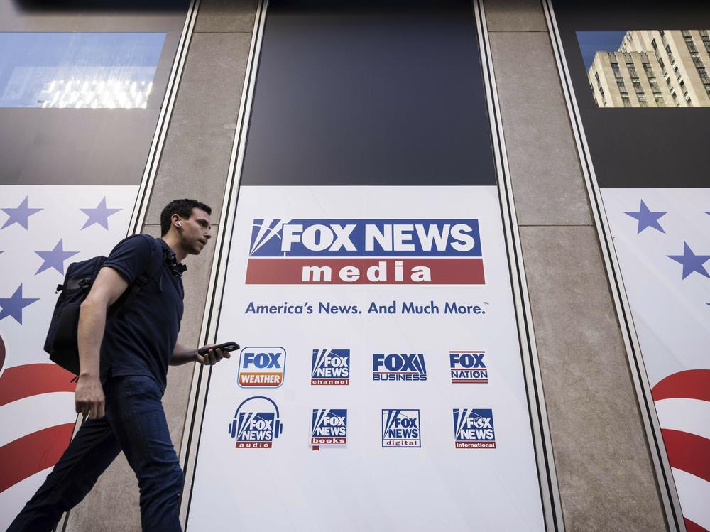 A person walks past the Fox News Headquarters in New York on April 12.