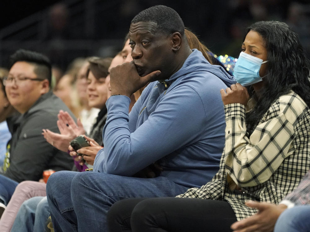 Former Seattle SuperSonics forward Shawn Kemp, center, attends a WNBA basketball game between the Seattle Storm and the Chicago Sky on May 18, 2022, in Seattle. Prosecutors in Washington state charged Kemp on Friday, April 14, 2023, with first-degree assault in a parking lot shooting last month over a stolen cell phone.