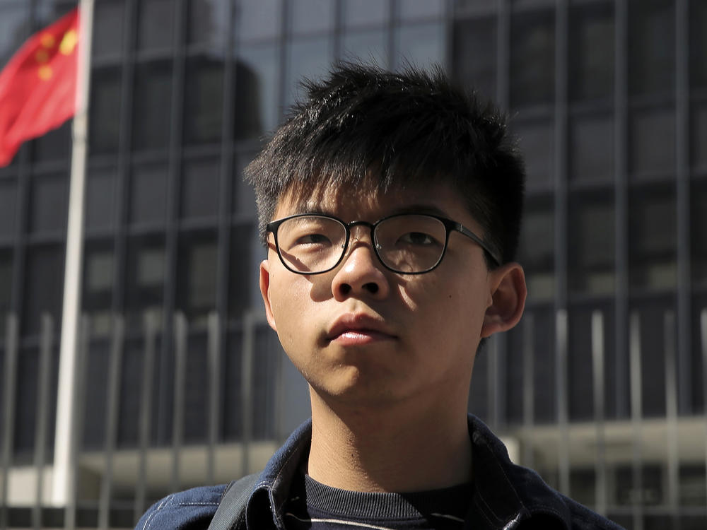 Pro-democracy activist Joshua Wong stands outside the Legislative Council building in Hong Kong on Nov. 28, 2019.