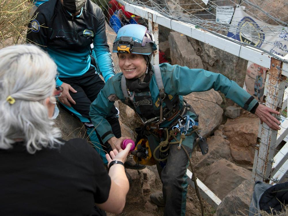 Beatriz Flamini leaves a cave in Los Gauchos, near the Spanish town of Motril on Friday.