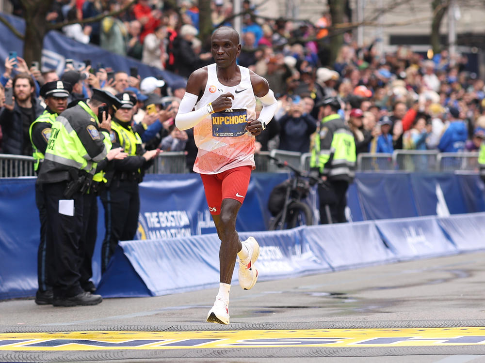 Eliud Kipchoge crosses the finish line and takes sixth place in the professional Men's Division during the 127th Boston Marathon.