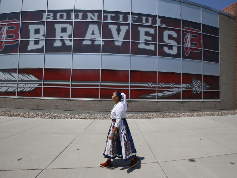 Lemiley Lane, who grew up in the Navajo Nation in Arizona, walks along the Bountiful High School campus during her junior year in 2020 in Bountiful, Utah. The school changed its nickname in 2021 to 