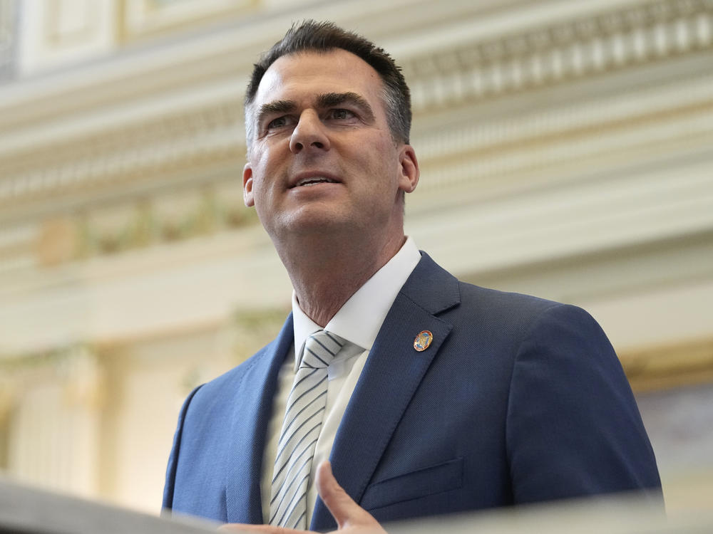 Oklahoma Gov. Kevin Stitt delivers his State of the State address on Feb. 6 in Oklahoma City. He has called on county officials heard making racist remarks to resign.