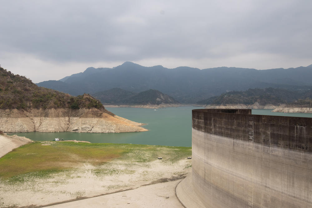 The Zengwen reservoir earlier in April. Low rainfall means it is filled at just 11% capacity this month. Its low water levels are ringed by a thick band of white – parched dry land left as the water recedes.