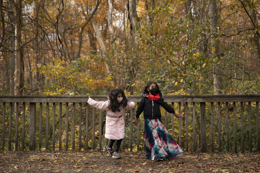 Kayla Patil and her friend, Elora, both 7, practice their Bollywood dance routine in a park in Virginia before a performance for a community Diwali festival.