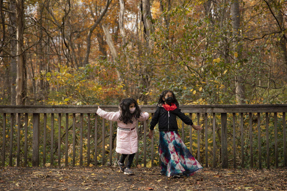Kayla Patil and her friend, Elora, both 7, practice their Bollywood dance routine in a park in Virginia before a performance for a community Diwali festival.