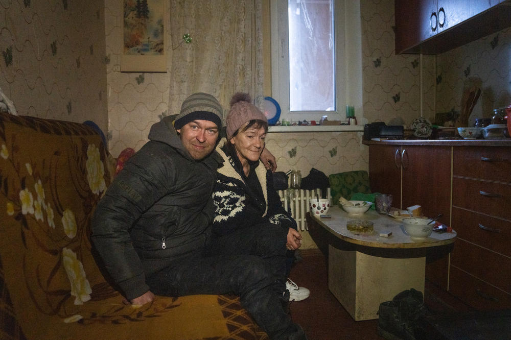 Denys Bezuglyy and Natasha Slyusarenko, friends of Dudnik's, are visiting. Their apartment building has collapsed. They stay at different friends' homes every few weeks.