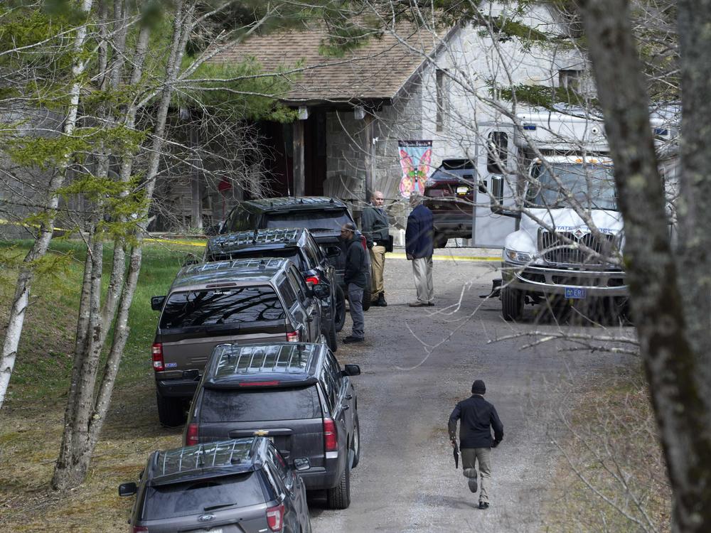 Investigators work at the scene of a deadly shooting, Tuesday, April 18, 2023, in Bowdoin, Maine.