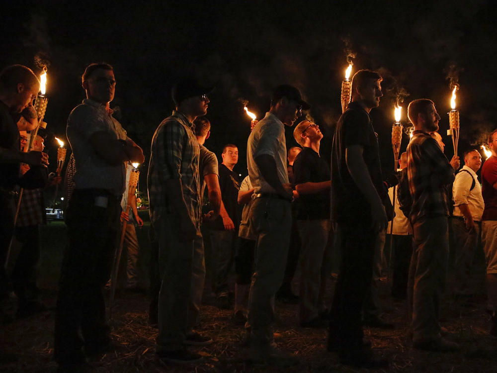 Multiple white nationalist groups march with torches through the University of Virginia campus on Aug. 11, 2017, in Charlottesville, Va.
