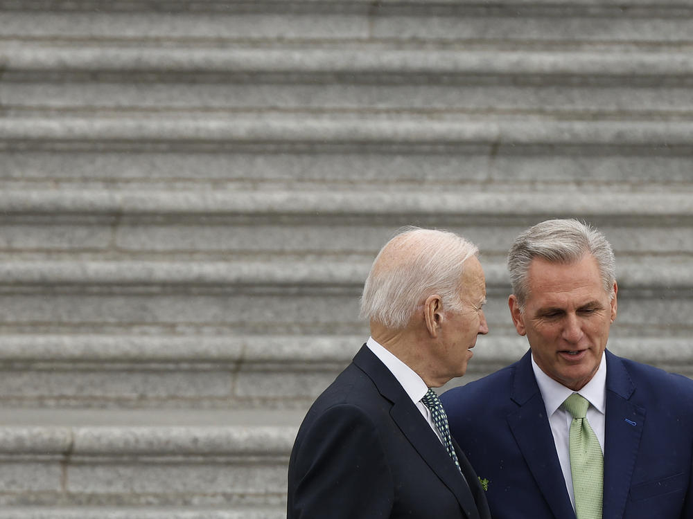 President Biden and Speaker Kevin McCarthy speak as they walk out of the U.S. Capitol on March 17 after a St. Patrick's Day luncheon.