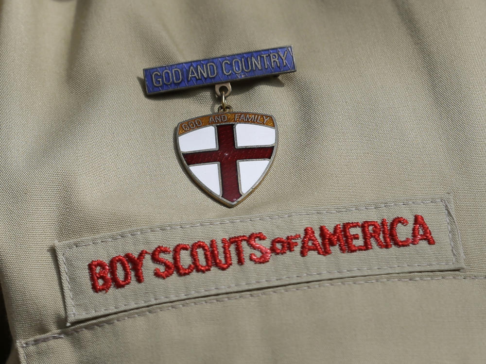 A close up of a Boy Scout uniform is photographed on Feb. 4, 2013, in Irving, Texas. On Tuesday, March 28, 2023, a federal district court judge upheld the approval of a $2.4 billion bankruptcy reorganization plan aimed at resolving tens of thousands of child sexual abuse claim against the Boy Scouts of America.