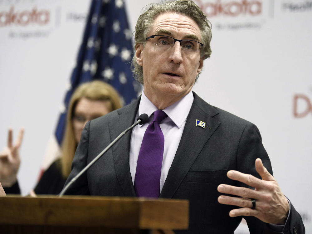 North Dakota Gov. Doug Burgum speaks at the state Capitol on April 10, 2020, in Bismarck, N.D. Burgum has signed a veto-proof bill into law, Thursday, April 20, 2023, that restricts transgender health care and criminalizes providers who give gender-affirming care to people under 18.