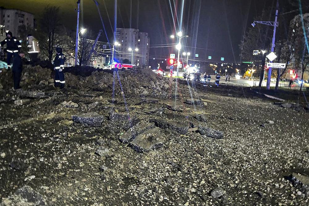 This photo taken Friday shows the site of a crater after an explosion in Belgorod, Russia. A large explosion hit the city late Thursday, and Russia's Defense Ministry said one of its Su-34 warplanes accidentally discharged ammunition over the city, about 20 miles from Russia's border with Ukraine.