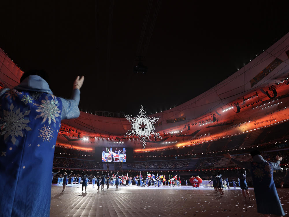 The flame is lowered during the closing ceremony of the 2022 Beijing Winter Paralympics. The next Paralympic Games will be held in Paris in August 2024.