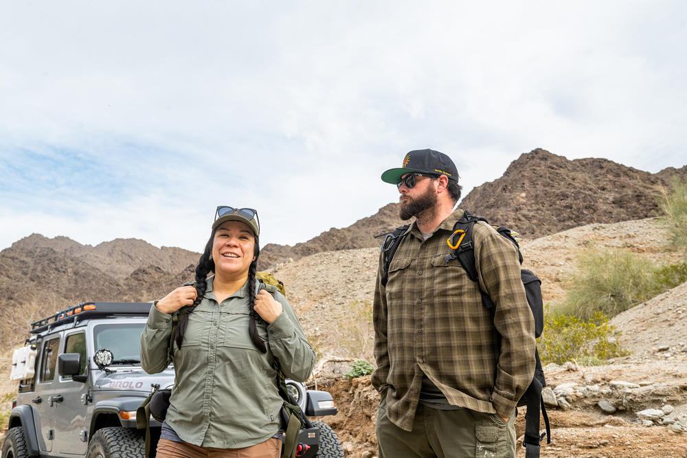 Jacqueline Arellano and James Cordero get ready to hike through a canyon that may be used to migrate north.