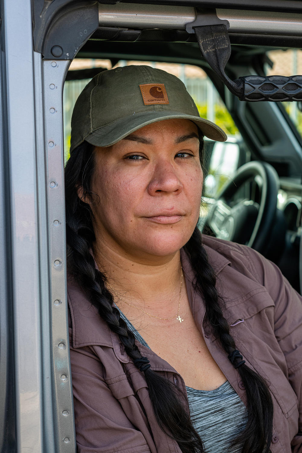Jacqueline Arellano rests for a moment in her jeep in Yuma, Ariz. on a recent Sunday.