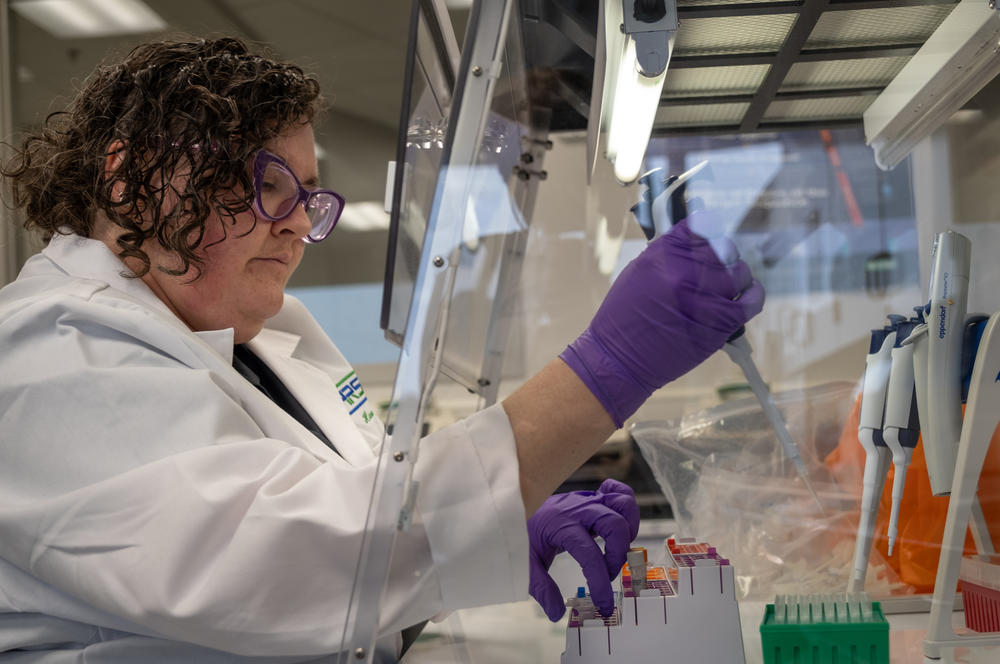 Hannah Thompson mixes probes and primers that she adds to the sample to help identify COVID in the water. The goal is to run these through a machine that will amplify any COVID in the liquid.