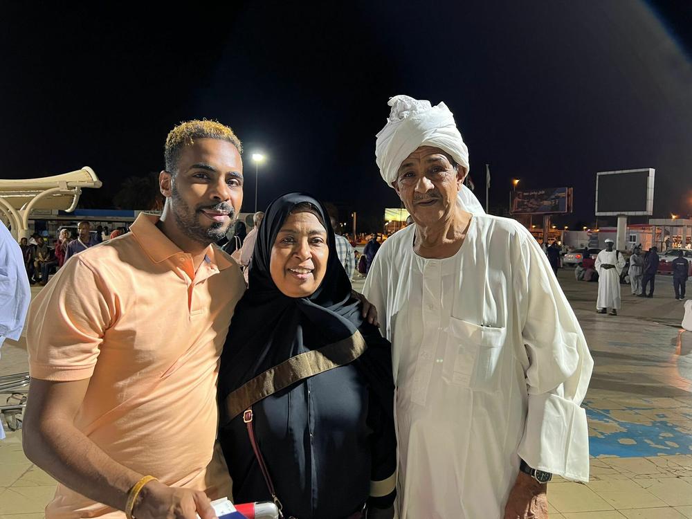 This photo of Nagwa Khalid Hamad is from July 22, 2022, at the Khartoum International Airport in Sudan, with her husband and her son Khalid Osman, who says, 