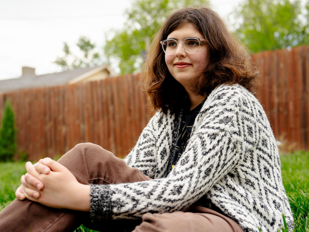 Chelsea Freels, a 17-year-old outside her home in Richmond Heights, Mo., on April 20, 2023. Freels, who is transgender, says she feels targeted by policies restricting gender-affirming care coming from Jefferson City, the state capital.