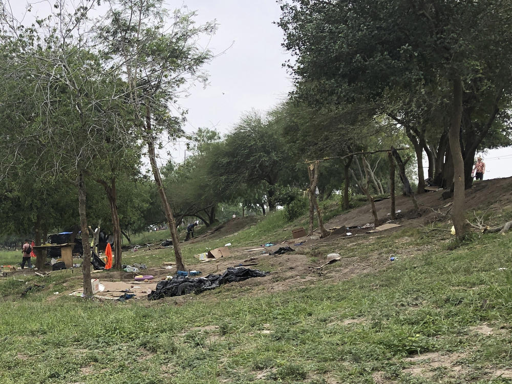 Makeshift tents and debris are seen at a migrant camp in Matamoros, Mexico, on Friday. About two dozen makeshift tents in the area were set ablaze and destroyed, across the border from Texas this week, witnesses said.