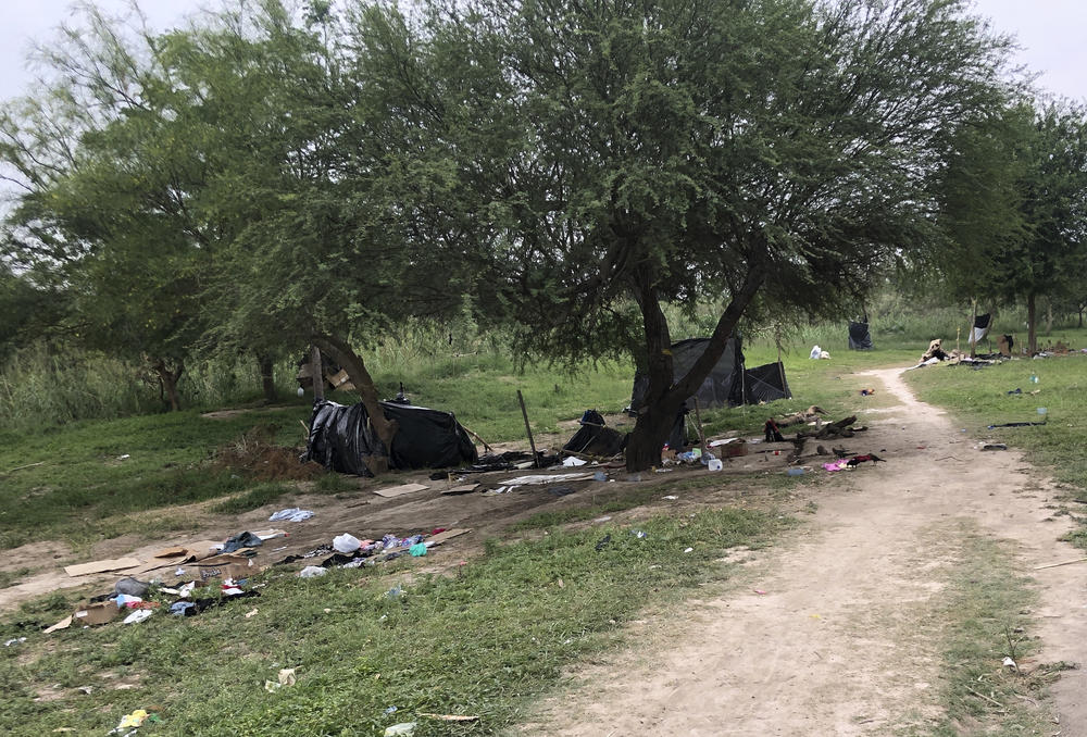 Makeshift tents and debris are seen at a migrant camp in Matamoros, Mexico, on Friday.