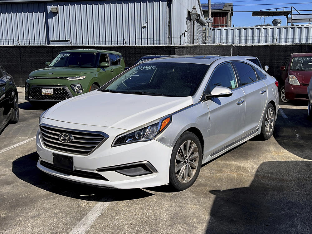 A Hyundai sedan sits in the parking lot of East Bay Tow Inc., where California Attorney General Rob Bonta held a news conference on Thursday.