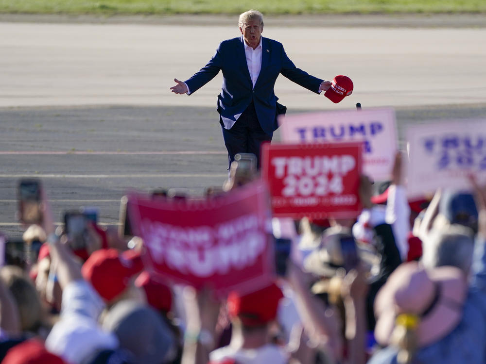 Former President Donald Trump walks across the tarmac as he arrives to speak at a campaign rally at Waco Regional Airport on March 25 in Waco, Texas.
