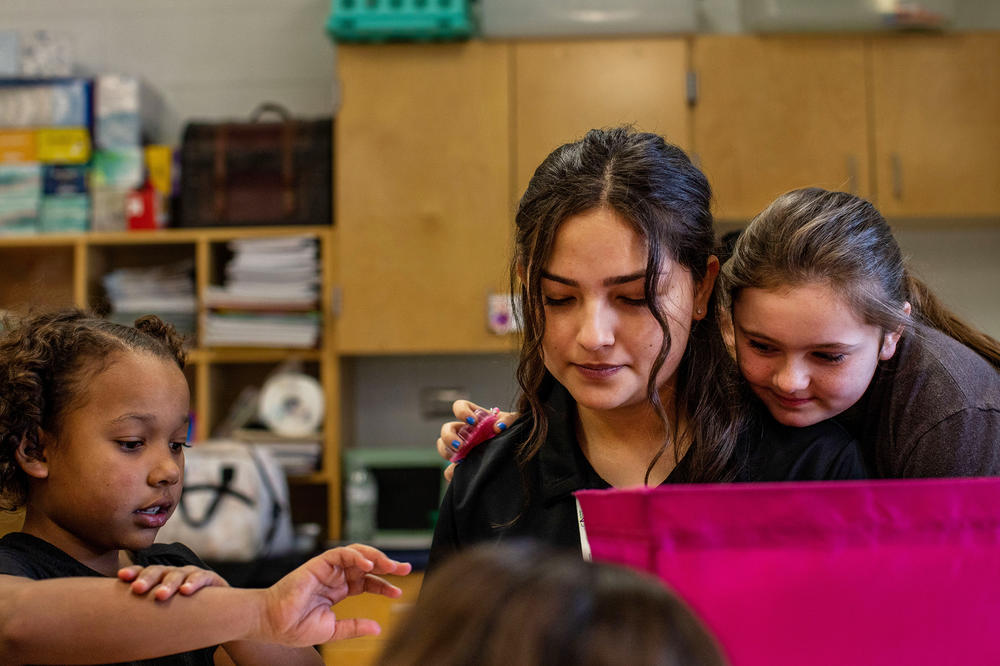 Isabel Tate, 15, at work (and play) in a second-grade classroom at Forester Elementary.