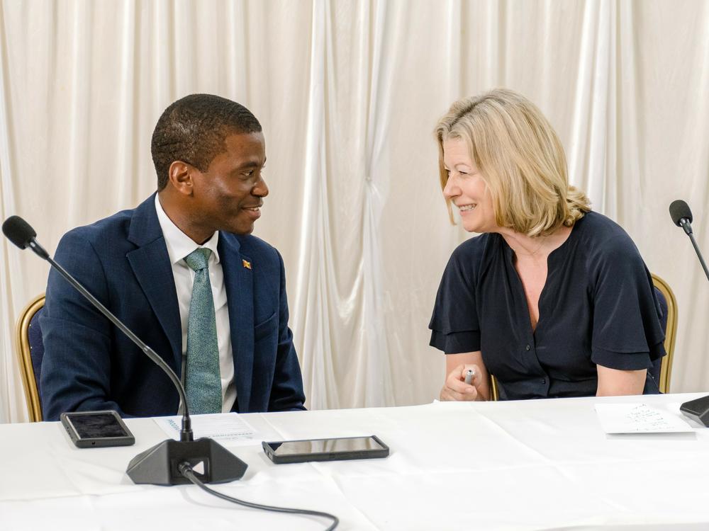 Grenada Prime Minister Dickon Mitchell and Laura Trevelyan at the Reparations Forum in Feb. 2023 in Grenada