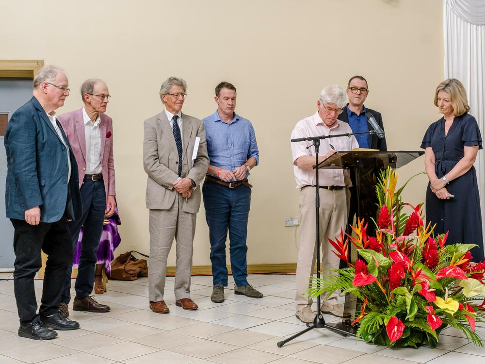 Members of the Trevelyan family at the Reparations Forum 2023 in Grenada, signing and presenting a formal apology.