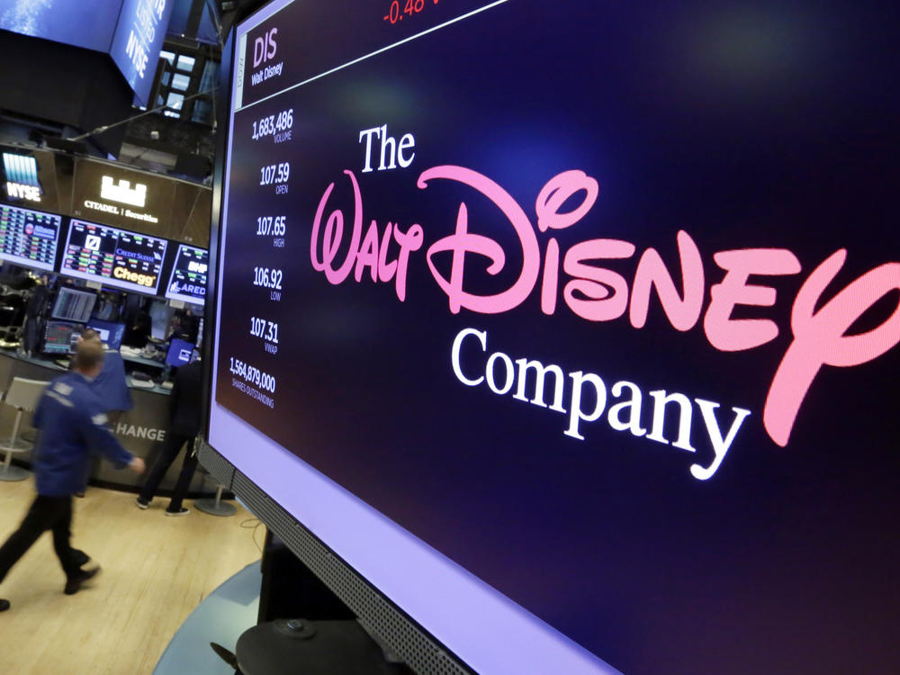 The Walt Disney Co. logo appears on a screen above the floor of the New York Stock Exchange on Aug. 8, 2017, in New York.