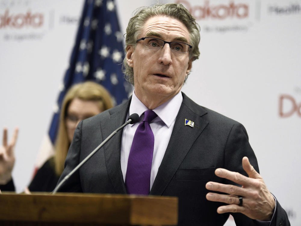 North Dakota Gov. Doug Burgum speaks at the state Capitol earlier this month in Bismarck, N.D. Burgum signed an abortion ban at six weeks of pregnancy — even in cases of rape or incest — into law on Monday.