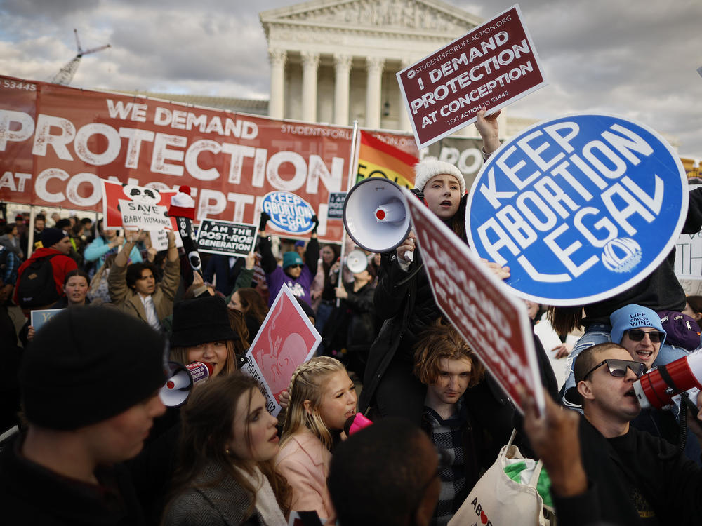 Anti-abortion and abortion rights activists protest in Washington, D.C. at the March for Life rally in January. The decision triggered strict abortion bans in more than a dozen states. A new study shows widespread confusion about abortion bans at Oklahoma hospitals.