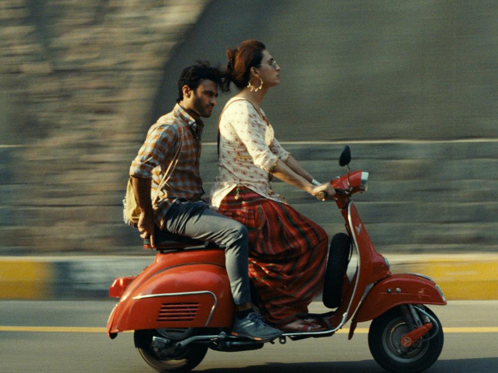 Ali Junejo (left) and Alina Khan portray a married man and a transgender woman who kindle a romance in Pakistani director Saim Sadiq's award-winning film <em>Joyland. </em>