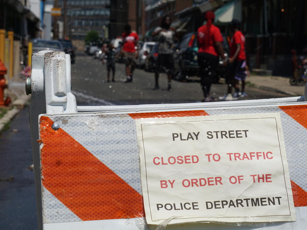 Children play outside in Kensington, a neighborhood in Philadelphia known for open-air drug markets and gun violence. Last year, due to safety concerns, the Philadelphia Police Department downsized its outdoor summer play program.