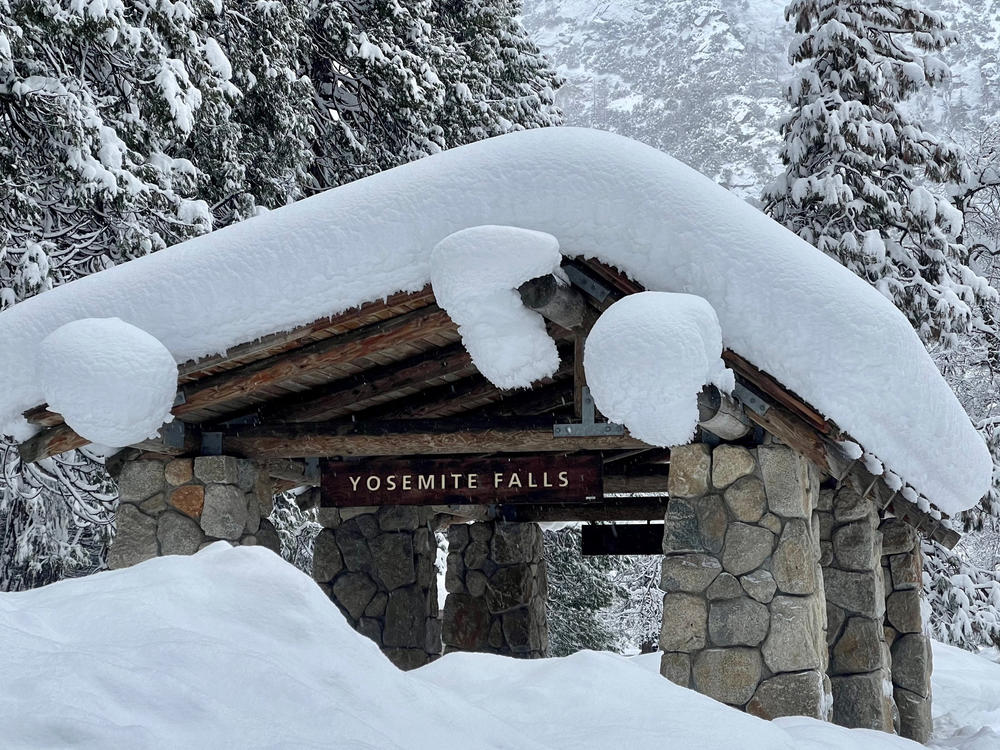 In this photo provided by the National Park Service, a structure at Yosemite Falls in Yosemite National Park, Calif., is covered in snow on Feb. 28.