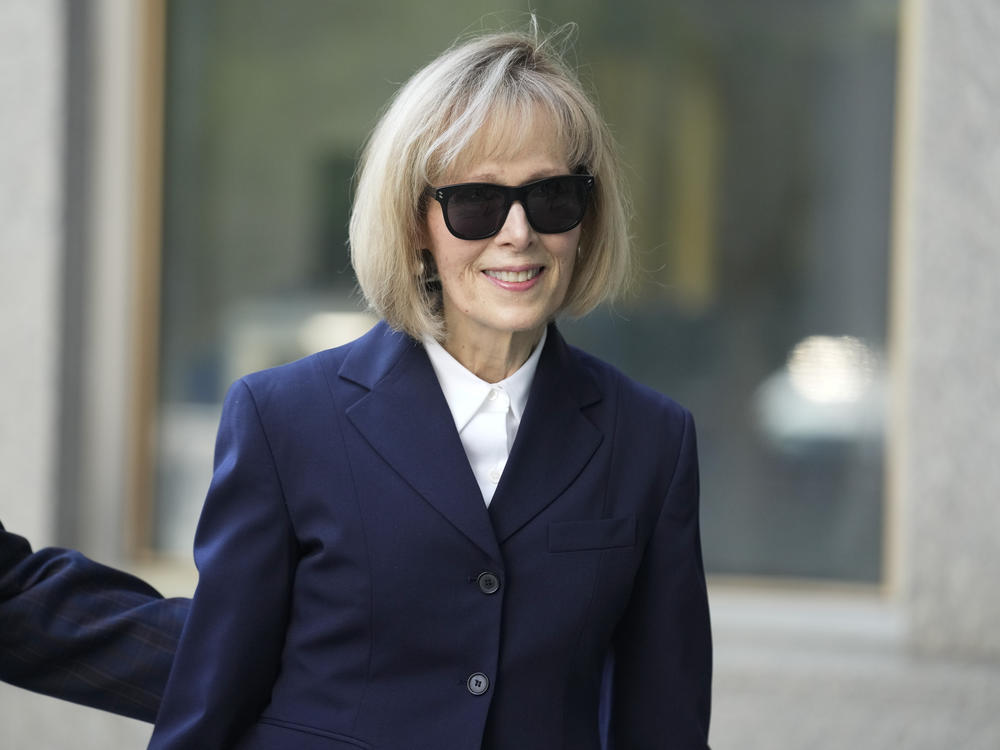Former advice columnist E. Jean Carroll arrives to federal court in New York on Wednesday. Jurors have been seated in the trial over Carroll's claim that former President Donald Trump raped her nearly three decades ago in a department store dressing room.