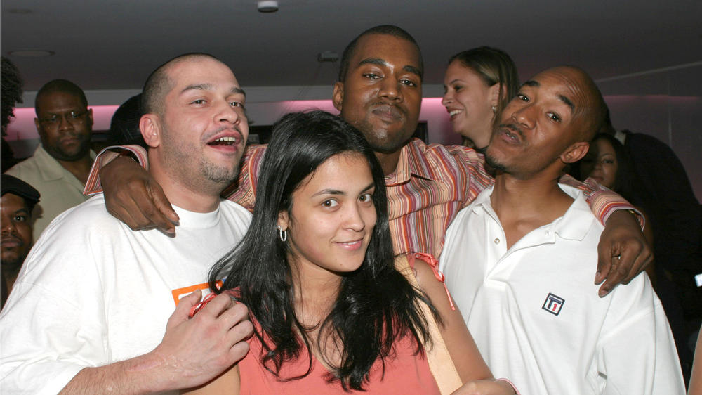 Kim Osorio with <em>The Source</em>'s Boo Rosario, <em>King</em>'s Datwon Thomas and Kanye West in 2003.