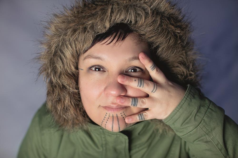 Artist and filmmaker Holly Mititquq Nordlum (Iñupiaq) is helping to revitalize the tradition of Iñupiaq tattoos. A woman's chin tattoos – tavlugun – 